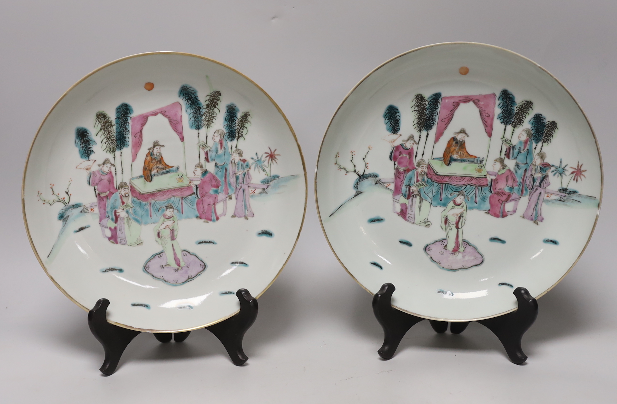 A pair of Chinese famille rose dishes painted with court scenes, a similar enamelled butterfly dish and an ‘immortals’ bowl, all 19th century